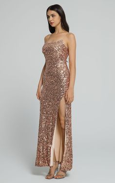 The intricate sequin detailing catches the light with every movement, creating a mesmerizing effect. The high leg slit adds a touch of drama and elegance, while the spaghetti straps accentuate your shoulders with grace. Crafted to perfection, this maxi dress exudes glamour and sophistication, making it a perfect choice for galas, red-carpet events, or any occasion where you want to shine like a star Premium Sequin fabric High Leg Slit for Spaghetti Strap Bodycon fit Model wearing S Maxi Dress Cocktail, Sequin Fabric, Dress With Cardigan, Gold Dress, High Leg, Knit Top, Spaghetti Strap, Fitness Models, Casual Dresses