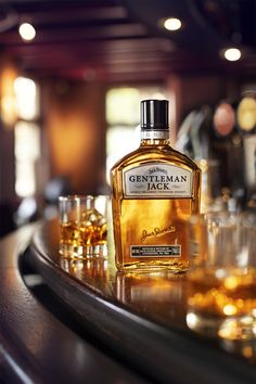 a bottle of ginterman whiskey sitting on top of a bar