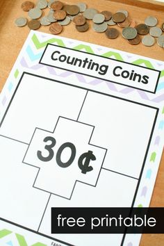 a counting game with coins on it and the words counting coins in front of it