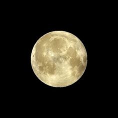 the full moon is seen in the dark sky