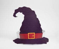 a purple witch hat sitting on top of a white table