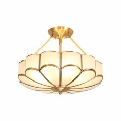 a light fixture with a flower design on the bottom and two lights in the middle