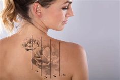 a woman with her back tattoo showing the measurements