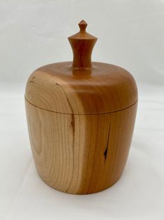 a wooden container with a lid on a white background