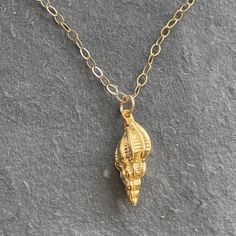 An 18 karat gold vermeil conch shell hangs from a 14k gold filled chain with 14k gold filled lobster clasp. Perfect for the Summer person in you! Please choose your length preference or the standard 18” will be dispatched. Your necklace will arrive beautifully giftboxed. Yellow Gold Charm Necklace With Lobster Clasp, Elegant Gold Shell Necklace With Lobster Clasp, 14k Gold Filled Shell Shaped Jewelry Gift, 14k Gold Shell Jewelry For Gifts, 14k Gold-filled Yellow Gold Charm Necklace With Lobster Clasp, 14k Yellow Gold Filled Charm Necklace, Dainty Gold Shell Charm Necklace, Shell-shaped Charm Necklace As A Gift, Shell-shaped Charm Necklaces For Gift