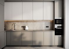 a modern kitchen with stainless steel cabinets and appliances