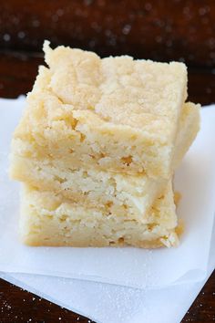 three pieces of cake sitting on top of a white napkin