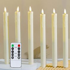 a group of white candles sitting next to each other