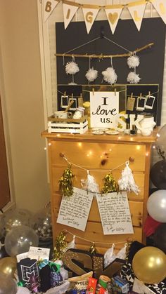 a table topped with lots of presents and balloons