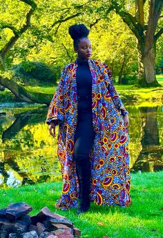 African print duster in a multi-coloured floral print. It has deep side splits and comes with a wide belt in the same fabric and can be worn with or without the belt. Wrap up securely with the same fabric belt or your favourite belt or wear as a throw on or cover up. May be dressed up or down to suit the occasion. Handmade in Ghana. 100% cotton. HAVE YOU CHECKED YOUR MEASUREMENTS AGANST THE SIZE CHART FOR THIS SHOP? Although we do our best to make sure that the colours displayed on our Website a Multicolor Floral Print Outerwear For Festival, Bohemian Belted Kimono With Kimono Sleeves, Bohemian Belted Kimono, Fitted Floral Kimono For Festival, Long Kimono With Vibrant Print For Festival, Floral Print Maxi Length Kimono For Festival, Festival Floral Print Maxi Kimono, Maxi Length Floral Kimono For Festival, Spring Long Belted Kimono