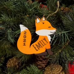 a wooden ornament hanging from a christmas tree