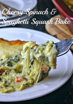 a slice of cheesy spinach and spaghetti squash bake on a white plate