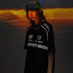 Rev up your wardrobe with the Haruja - Y2K Motorcycle Racing Tee, a perfect fusion of early 2000s nostalgia and modern streetwear. Featuring bold racing graphics and a dynamic design, this tee is perfect for motorcycle enthusiasts and fans of the Y2K aesthetic. Whether you're on the track or in the city, make a statement with this standout piece. Shop now to add a touch of retro racing flair to your wardrobe and enjoy the perfect blend of vintage style and modern comfort. SPECIFICATIONS Applicab Urban Streetwear T-shirt With Back Print, Techwear T-shirt With Letter Print For Streetwear, Urban Graphic Print Tops For Streetwear, Urban Style Athletic Short Sleeve Tops, Streetwear T-shirt With Letter Print, Sporty Graphic Print T-shirt For Streetwear, Sporty Short Sleeve T-shirt With Graffiti Print, Techwear Style Graphic T-shirt For Streetwear, Techwear Tops With Graphic Design For Streetwear