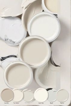 several white dishes with different shades of paint