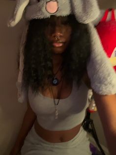 a woman wearing a bunny hat with her hair in the shape of an elephant's head