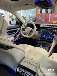 the interior of a mercedes s - class sedan with its touchscreen and navigation system