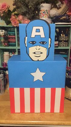 a cardboard captain america box sitting on top of a table