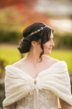 a woman in a white dress with a bow on her head