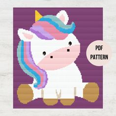 a cross stitch pattern of a unicorn with a rainbow mane on it's head