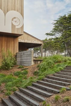 there are many steps leading up to the front of this building that is made out of wood