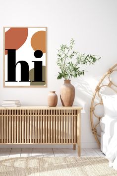 an art print hangs on the wall next to a wooden bench with vases and plants