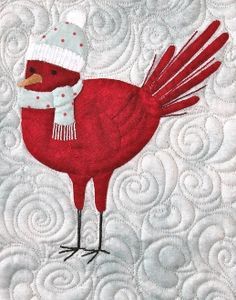 a red bird wearing a santa hat and scarf