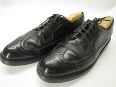 A classic vintage pair of black leather longwings from FLORSHEIM. The model is 93602 Kenmoor, often known as the iconic "V-cleat". THese are most likely from the 1960s. Classic American style, and in decent pre-owned condition, with natural wear throughout (see images). Still an all round decent shoe when worn, though. A nice way to get a pair of vintage 93602s for short money. Clean 'em up and they'll last a lifetime! Please see the images for more details. Marked 9.5 C and measure true to size Classic Oxfords With Vibram Sole For Derby, Classic Oxfords With Vibram Sole For Business, Classic Business Oxfords With Vibram Sole, Black Wingtip Derby Shoes For Semi-formal Occasions, Black Wingtip Derby For Semi-formal Occasions, Formal Plain Toe Oxfords With Vibram Sole, Classic Oxfords With Vibram Sole, Black Wingtip Derby Shoes With Goodyear Welt, Black Goodyear Welted Wingtip Derby Shoes