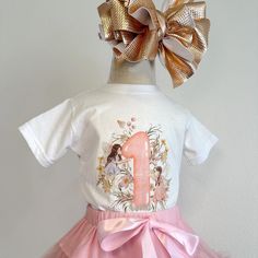 ✨ Celebrate Your Little One's Magical Milestone with Our Enchanting First Birthday Shirt! ✨ This charming shirt features whimsical watercolor fairies, delicate flowers, and a vibrant number one graphic, all crafted with love to create a magical look perfect for your little one's big day. 🌸 *A Lace Anchor Original Design* 🌼 Soft and Comfortable: Made from 100% combed, ring-spun Cotton, this shirt is ultra-soft and gentle against your baby's skin, ensuring they stay comfortable throughout their Watercolor Fairies, First Birthday Floral, Pixie Garden, 1st Birthday Outfit, Pixie Hollow, Whimsical Watercolor, First Birthday Shirts, 1st Birthday Outfits, Delicate Flowers