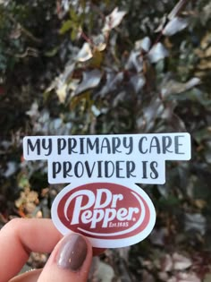 someone holding up a sticker that says, my primary care provided is dr pepper