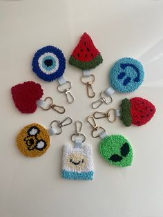 crocheted keychains are arranged in the shape of fruits and vegetables