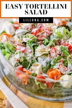 this easy tortellini salad is loaded with fresh vegetables, cheese and dressing it's ready to be eaten