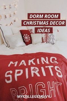 a bedroom decorated for christmas with red and white bedding, lights and decorations on the wall