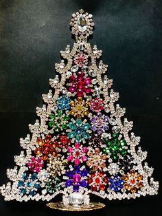 a multicolored christmas tree made out of jewels