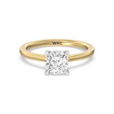 a yellow gold engagement ring with a princess cut diamond in the center, on a white background