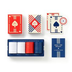 playing cards and games are laid out on a white surface with red, blue, and white stripes