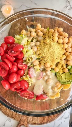 a glass bowl filled with different types of food