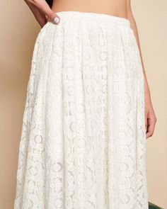 Indulge in the romantic elegance of the Vanilla Lace Midi Skirt, a graceful companion for your leisurely strolls. Crafted from delicate floral lace fabric, it exudes timeless charm with its high-waisted silhouette and refined details. Slip into this enchanting piece, fastened with a concealed zip, and let its ethereal beauty accompany you on your every adventure. The details- High waisted midi skirt in a floral lace fabric. Fully lined and finished with a narrow waistband and a concealed zip fas