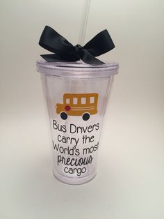 a plastic cup with a black bow on the top that says bus drivers carry the world's most precious cargo