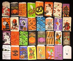 many different halloween themed items are arranged in a square pattern on a black background,