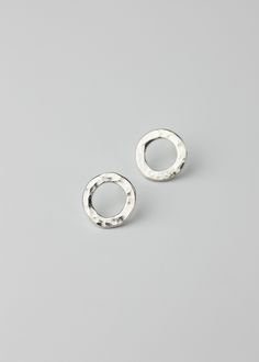 Modern round O-ring stud earrings featuring a hammered texture for a shimmery effect. Made with thick sterling silver and approximately 0.5 inch outer diameter. Modern Round, Hair Ornaments, O Ring, Ring Earrings, Hair Pins, Brooch Pin, Necklaces Bracelets, Gift Card, Stud Earrings