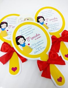 snow white and the seven dwarfs inspired party favors with red bows, tags and ribbons