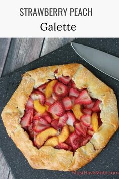 a pie with sliced strawberries on top