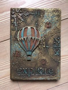 a metal plaque with a hot air balloon on it