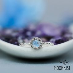 This beautiful Sterling Silver Rainbow Moonstone Promise Ring has an elegant vintage style that is certain to please. It features a Moonstone cabochon with a fancy rose cut and plenty of blue flash. We are happy to create this ring for you in a variety of sizes and finish options. This lovely ring features a bright and sparkling stone, framed by a Sterling Silver Gallery Wire Bezel which both protects and enhances. The band has been created from a gently hammered round wire. The band measures 1 Sterling Silver Moonstone Ring, Moonstone Ring Sterling Silver, Ring Moonstone, Moonstone Cabochon, Textured Ring, Lovely Ring, June Birthstone, Quartz Ring, Moonstone Ring