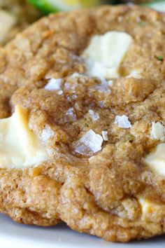 a close up of a cookie on a plate with other food items in the background