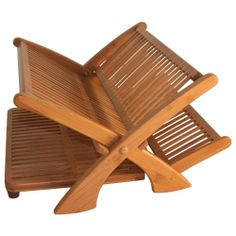 three wooden chairs sitting on top of each other