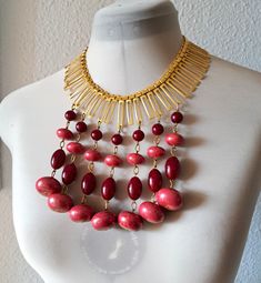 Gold tone choker style necklace, shiny, interesting and ornate with large dangle plastic beads in dark and light red. Very good condition. necklace length - 44 cm/ 17.2''  height dangles beads - 10 cm/ 3.9'' Vintage Red Necklace With Dangling Beads, Red Vintage Necklace With Dangling Beads, Red Necklaces With Wooden Beads For Festival, Red Beaded Choker With Large Beads, Red Large Beads Choker Necklace, Red Dangling Beads Necklace For Festivals, Choker Style Necklace, Choker Style, Wedding Jewellery Necklace