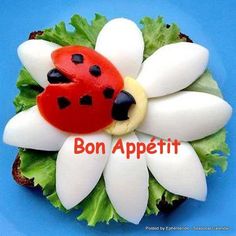 a ladybug sandwich with lettuce and cheese on it