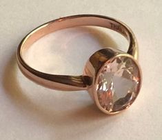 An ample size 8, this stamped 10K signed BBJ ring is made in Thailand and dates to the 1990s. The stone is a really pretty faceted oval cut faceted pale lilac (almost pink to me) stone that I was told by the owner is morganite. I have not personally tested the stone, and if I didn't know better I would've said it was a pale amethyst. That said, this is not glass, and it is a real gem stone. This ring is in very good, pre-owned vintage condition, no damage or repair and ready to wear. Just lovely Classic Oval Faceted Topaz Ring, Oval Faceted Topaz Anniversary Ring, Oval Solitaire Topaz Ring In Rose Gold, Rose Gold Morganite Ring, Rose Gold Morganite, Morganite Ring, Oval Cut, Morganite, Solitaire Ring