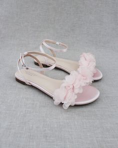 "Classy satin flat sandals with chiffon flowers and ankle strap. Effortless yet adorable to wear on your favorite occasion. Can be pair with dress or casual look. DETAILS: COLORS AVAILABLE: Women: Champagne, Ivory, Light Blue, Navy, Pink, Silver and White Kids: Champagne, Ivory, Light Blue, Pink, and White UPPER: Synthetic upper and lining MATERIALS: Mandmade outsole STYLE NAME: MADDY Not sure of which size to purchase? Shoes measurements are as follow: (Please note measurements taken the length Kids Heels, Fancy Sandals, Women's Slip Ons, Flower Flat, Girls Flats, Girls Heels, Pink Flats, Bridesmaid Shoes, Chiffon Flowers